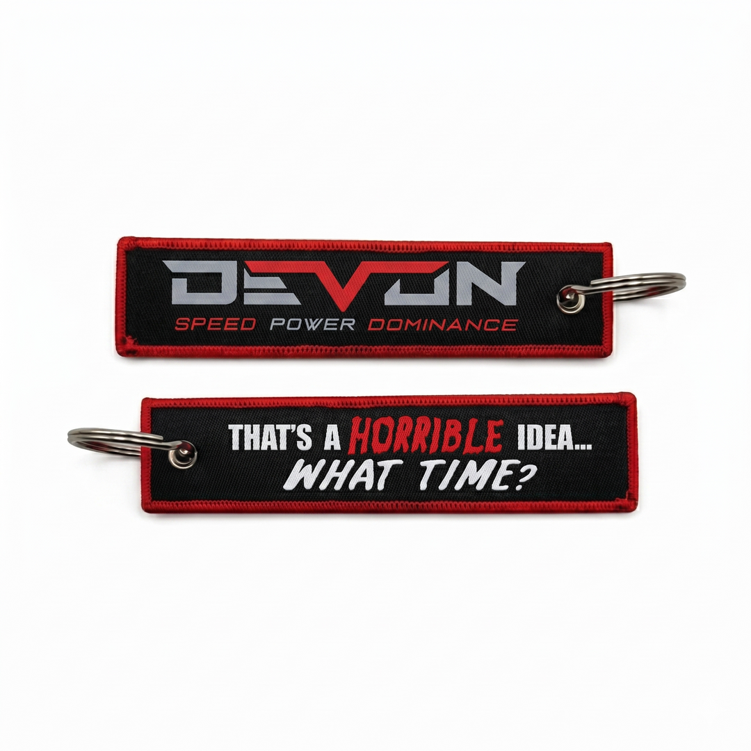 Devon Built Horrible Idea keychain with witty slogan graphic, front view